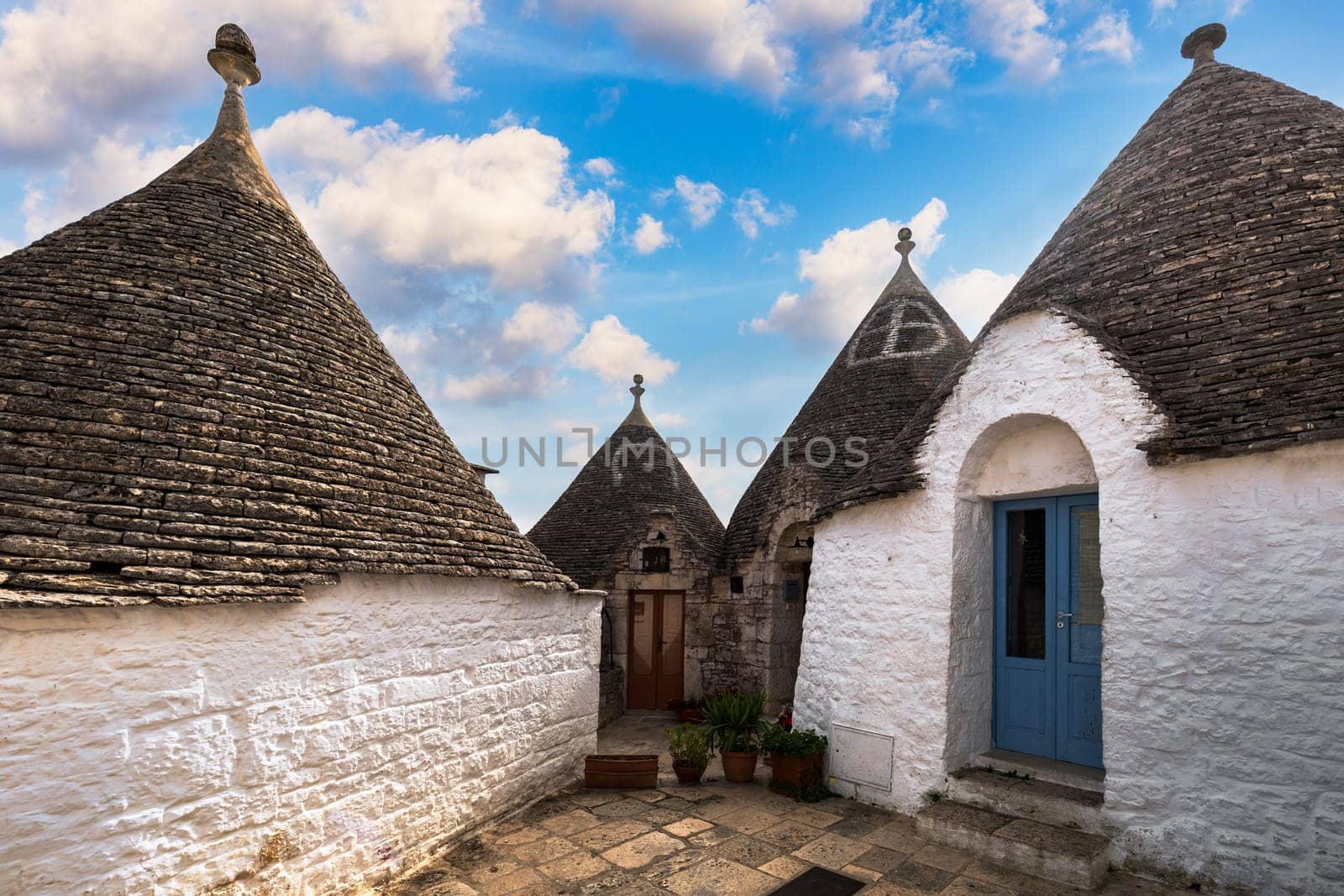 The traditional Trulli houses in Alberobello city, Apulia, Italy. Cityscape over the traditional roofs of the Trulli, original and old houses of this region, Apulia, Alberobello, Puglia, Italy. 