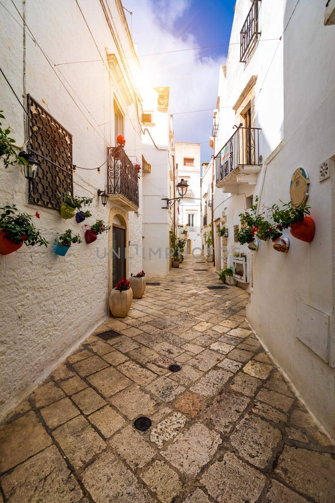 Scenic sight in Locorotondo, Bari Province, Apulia (Puglia), Italy. Characteristic streets in the Locorotondo in Puglia, Italy. Locorotondo is a town of the Metropolitan City of Bari, Apulia, Italy.