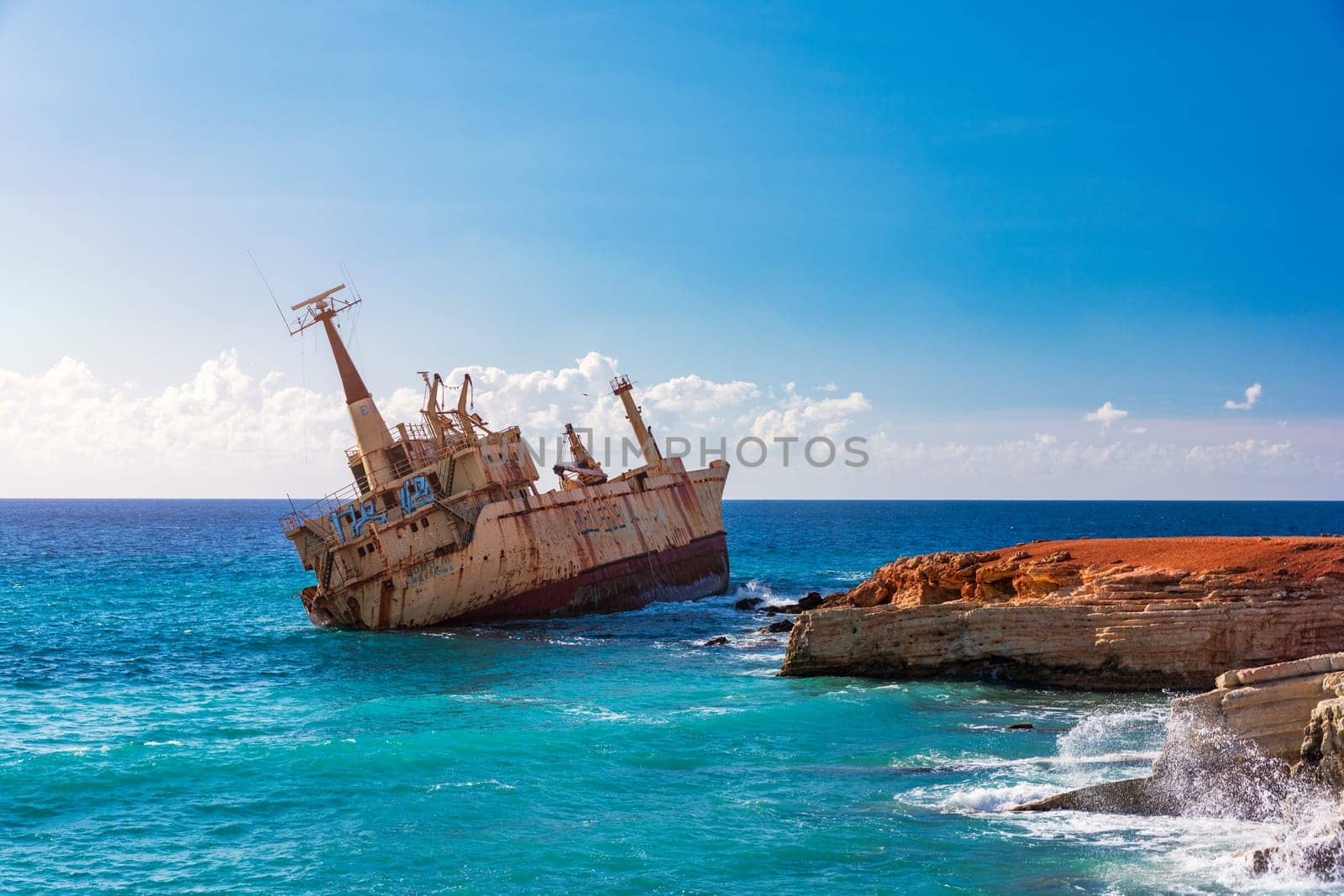 Abandoned Edro III Shipwreck at seashore of Peyia, near Paphos, Cyprus. Historic Edro III Shipwreck site on the shore of the water in Cyprus. Aerial view of Shipwreck EDRO III, Pegeia, Paphos.
