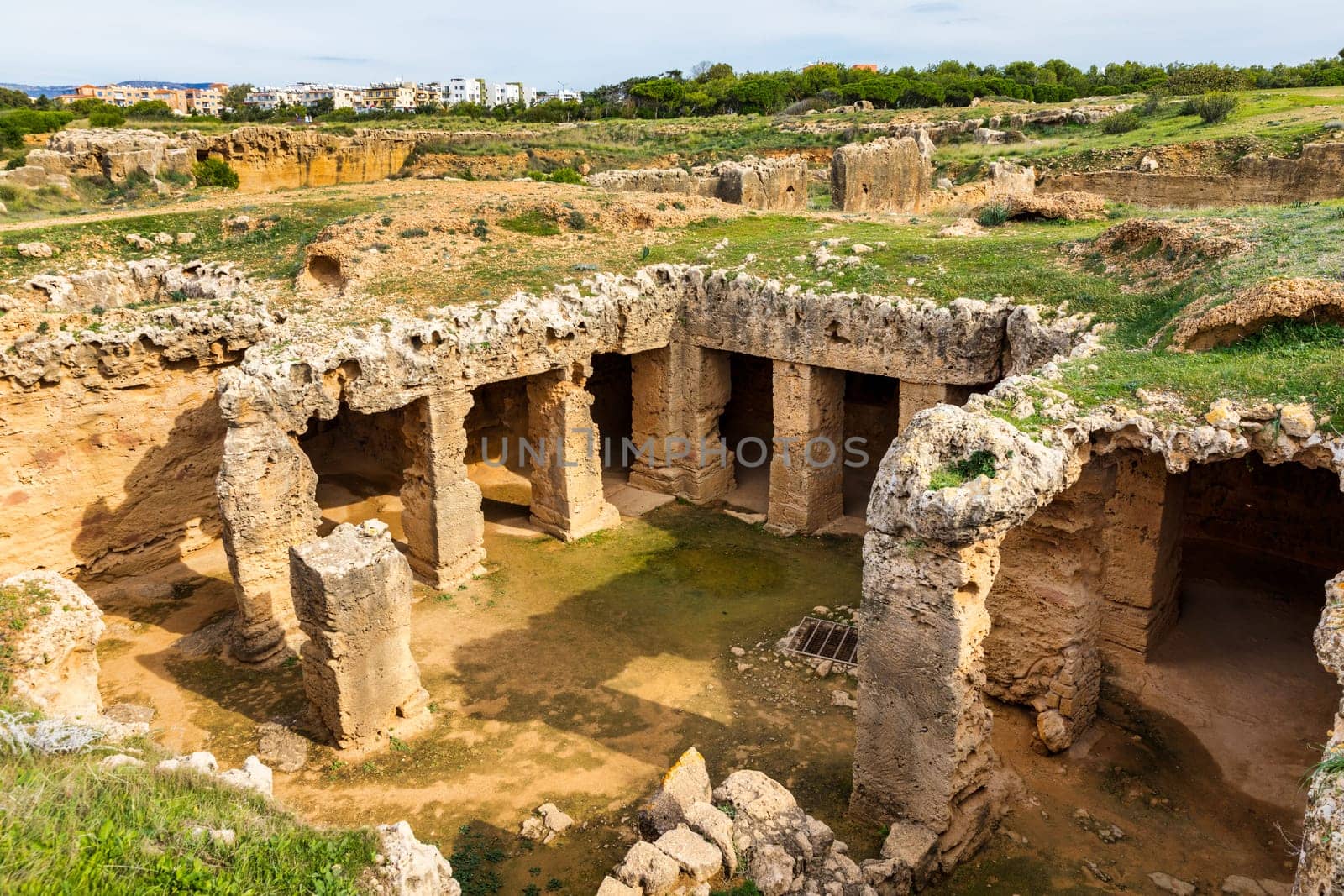 Cyprus. Pathos. Tombs of the Kings. Paphos Royal antique necropolis. Underground hall with columns under the open sky. Paphos archaeological memorial. Touristic sightseeing Cyprus. Travel to Cyprus.