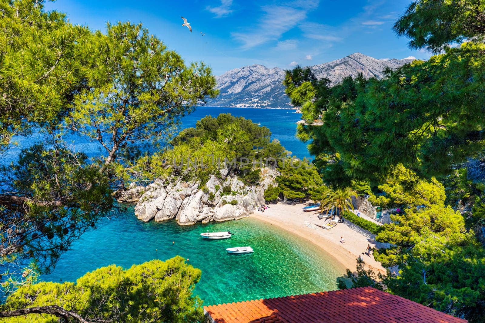 Amazing aerial view of the beautiful Podrace beach in Brela, Makarska Riviera, Croatia. Aerial view of Podrace beach and waterfront on Makarska riviera, Brela, Dalmatia region of Croatia.
