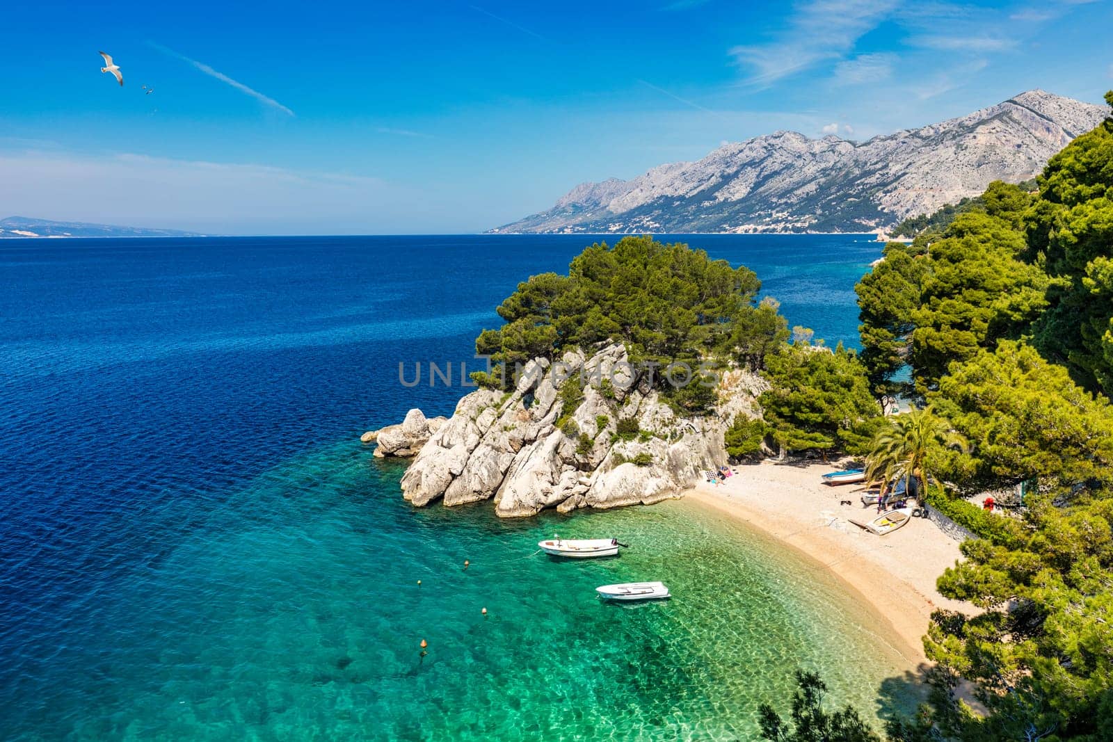 Amazing aerial view of the beautiful Podrace beach in Brela, Makarska Riviera, Croatia. Aerial view of Podrace beach and waterfront on Makarska riviera, Brela, Dalmatia region of Croatia.