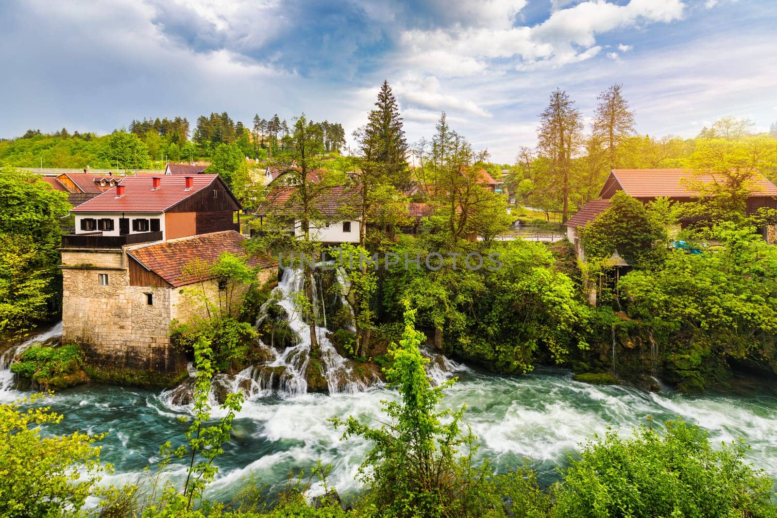 Village of Rastoke near Slunj in Croatia, old water mills on waterfalls of Korana river, beautiful countryside landscape. Landscape with river and little waterfalls in Rastoke village, Croatia.