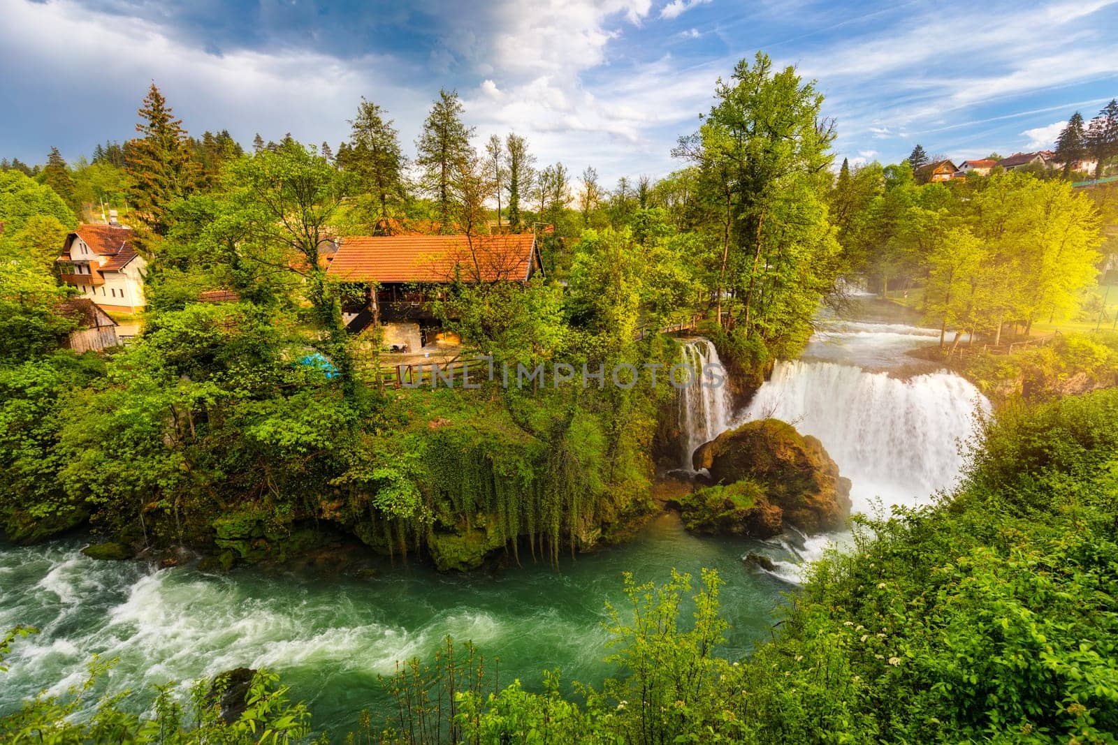 Village of Rastoke near Slunj in Croatia, old water mills on waterfalls of Korana river, beautiful countryside landscape. Landscape with river and little waterfalls in Rastoke village, Croatia.