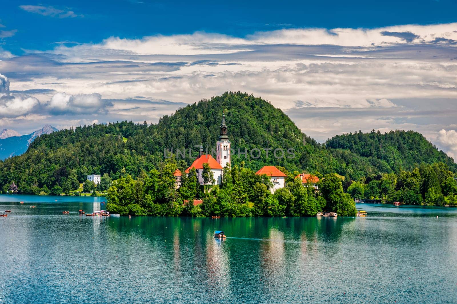 Lake Bled in Slovenia. Beautiful mountains and Bled lake with small Pilgrimage Church. Bled lake and island with Pilgrimage Church of the Assumption of Maria. Bled, Slovenia, Europe.
