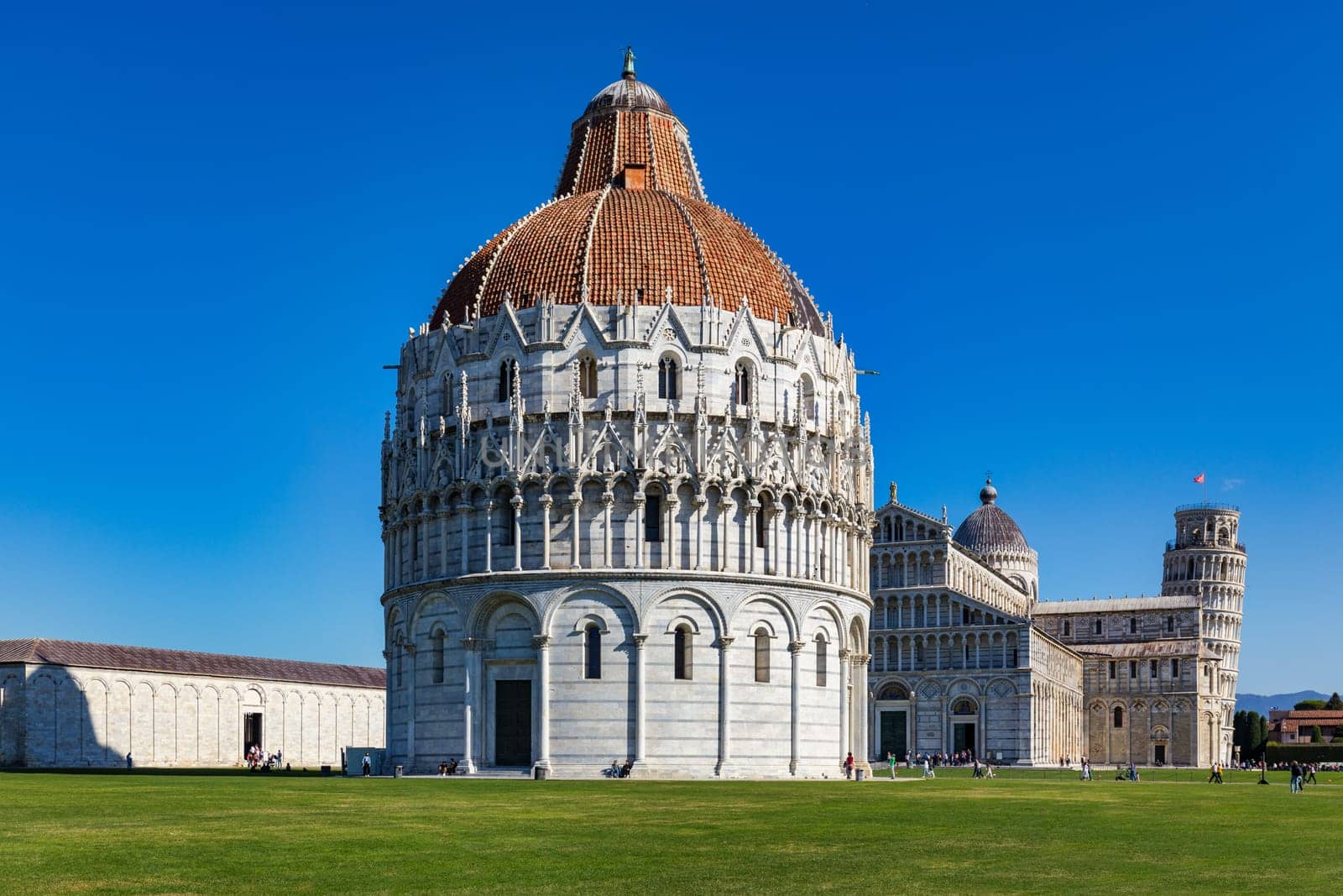 Pisa Cathedral and the Leaning Tower in a sunny day in Pisa, Italy. Pisa Cathedral with Leaning Tower of Pisa on Piazza dei Miracoli in Pisa, Tuscany, Italy.