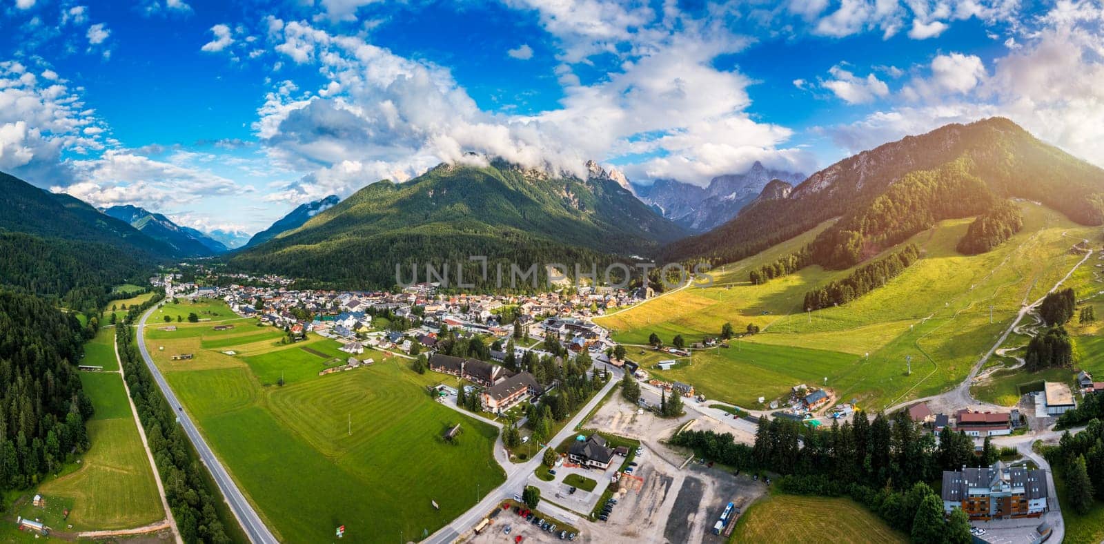 Kranjska Gora town in Slovenia at summer with beautiful nature and mountains in the background. View of mountain landscape next to Kranjska Gora in Slovenia, view from the top the town Kranjska Gora.
