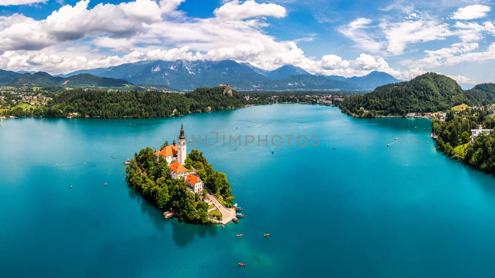 Lake Bled in Slovenia. Beautiful mountains and Bled lake with small Pilgrimage Church. Bled lake and island with Pilgrimage Church of the Assumption of Maria. Bled, Slovenia, Europe.