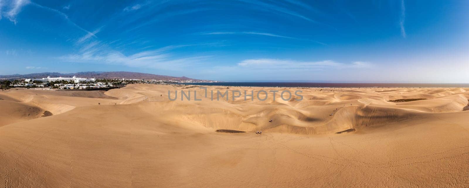 Landscape with Maspalomas town and golden sand dunes, Gran Canaria, Canary Islands, Spain. Natural Reserve of Dunes of Maspalomas, in Gran Canaria, Canary Islands, Spain.