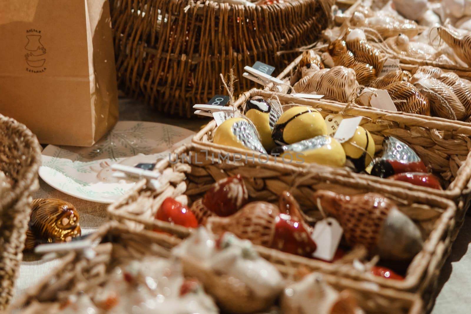 Sale of handmade ceramic Christmas tree toys at the Christmas Fair. Black Friday for the winter holidays