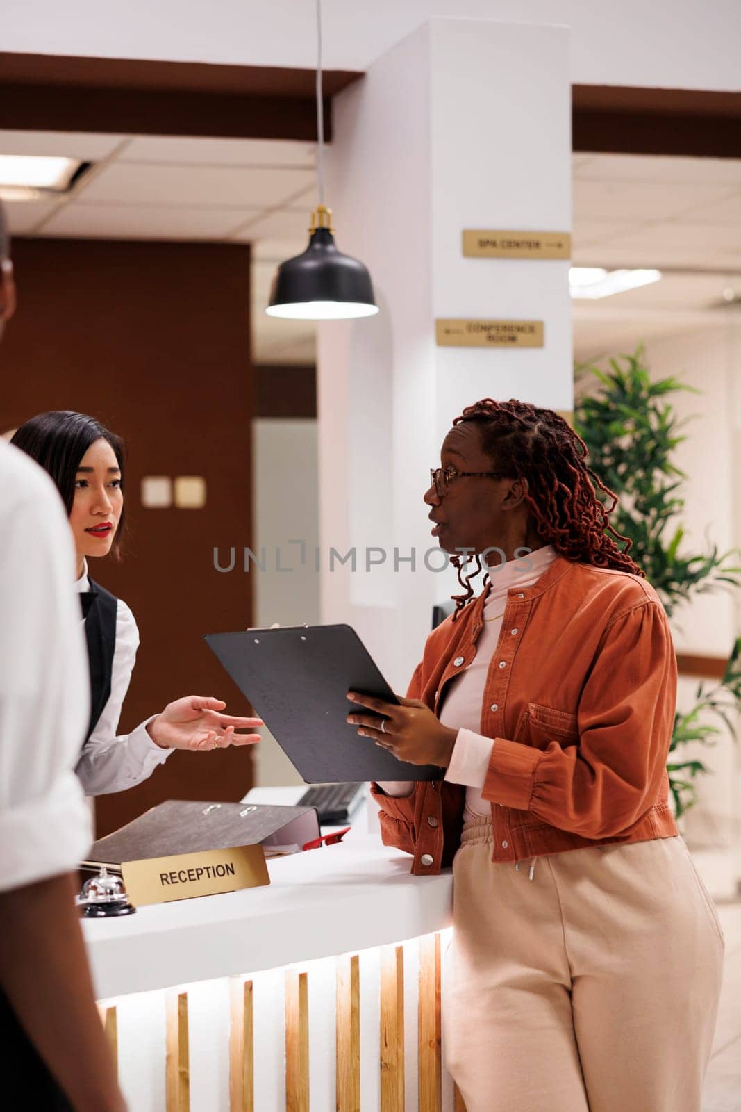 Young woman doing check in process by DCStudio