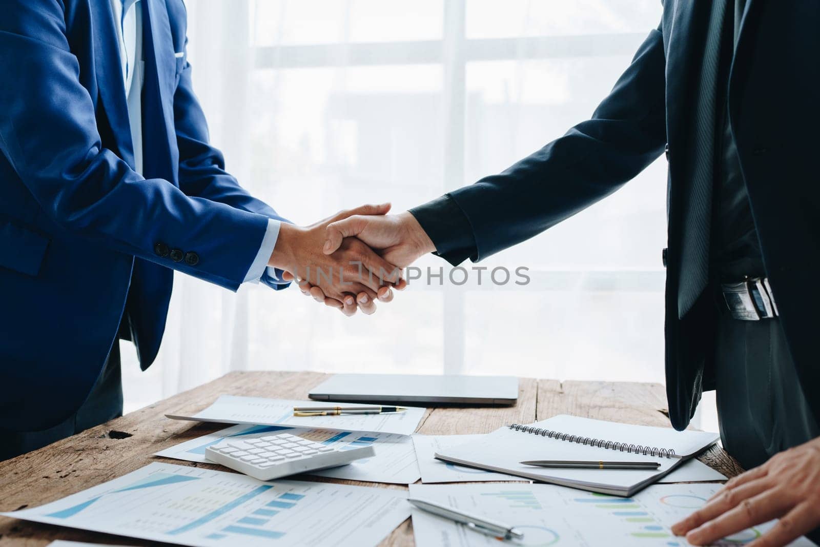 Young businesswoman collaborate with partners to increase their business investment network for Plans to improve quality next month in their office. agreement concept. by Manastrong