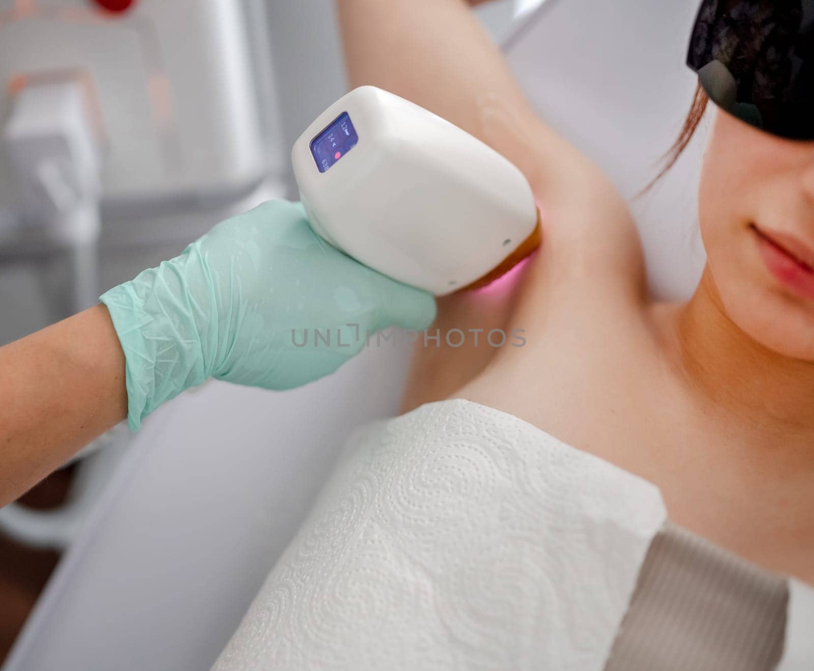 Master Conducts Laser Hair Removal Procedure For Client In Salon