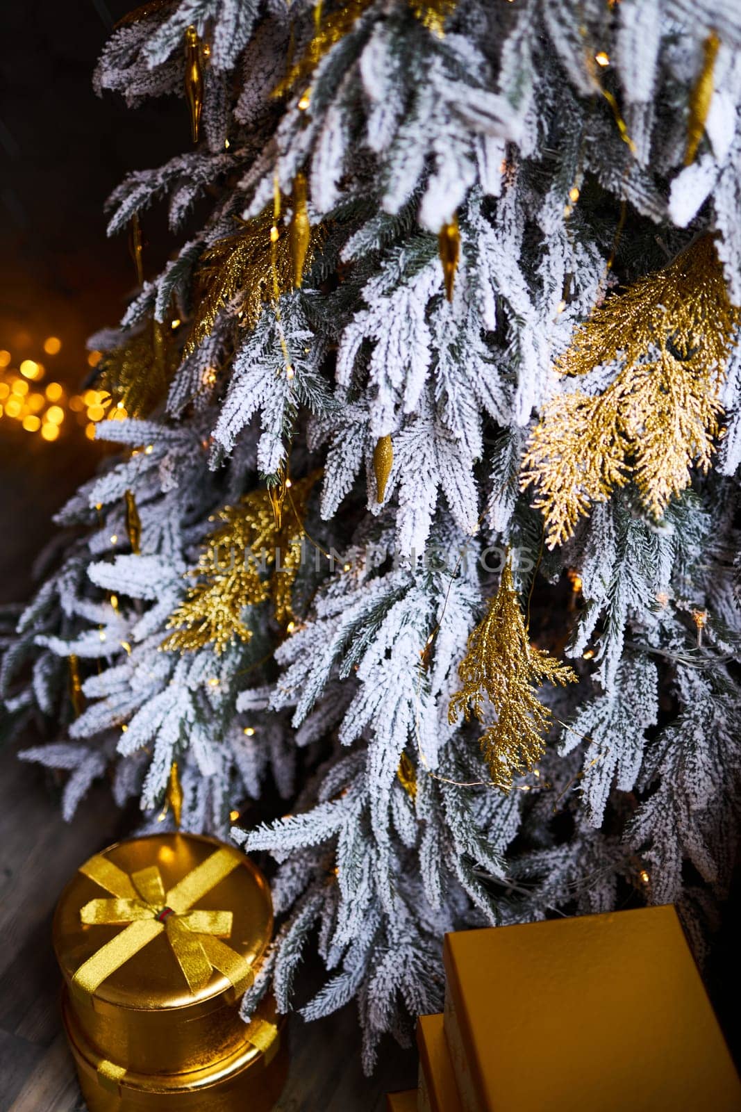 Close up of decorated Christmas tree with golden baubles and ornaments. Shallow Depth of Field
