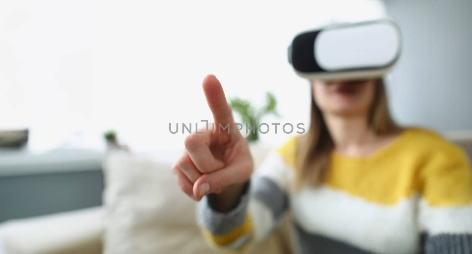 Woman wearing virtual glasses, close-up, blurry. Augmented reality touch, VR device, online training
