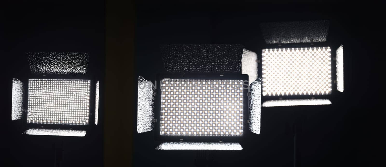 Two luminous LED panels for photography on a black background. Photo panel lighting LED photography with tripod