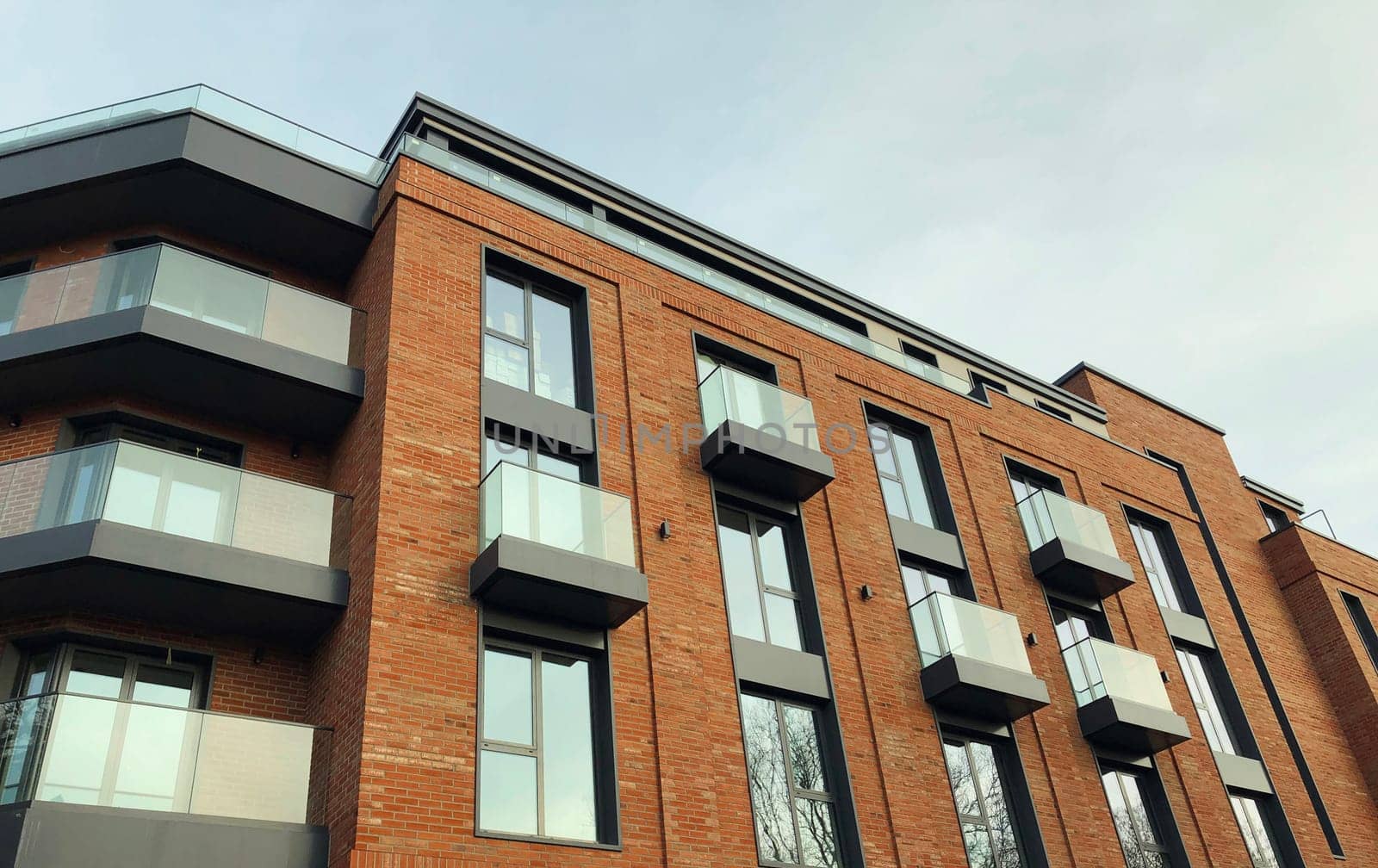 Architecture, real estate, residential apartment building with panoramic windows, modern complex