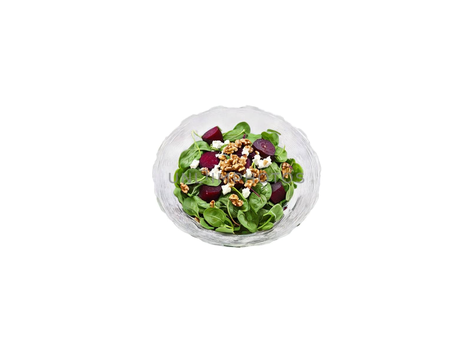 Salad baby spinach with roasted beets goat cheese and walnuts served in a transparent glass. Food isolated on transparent background.