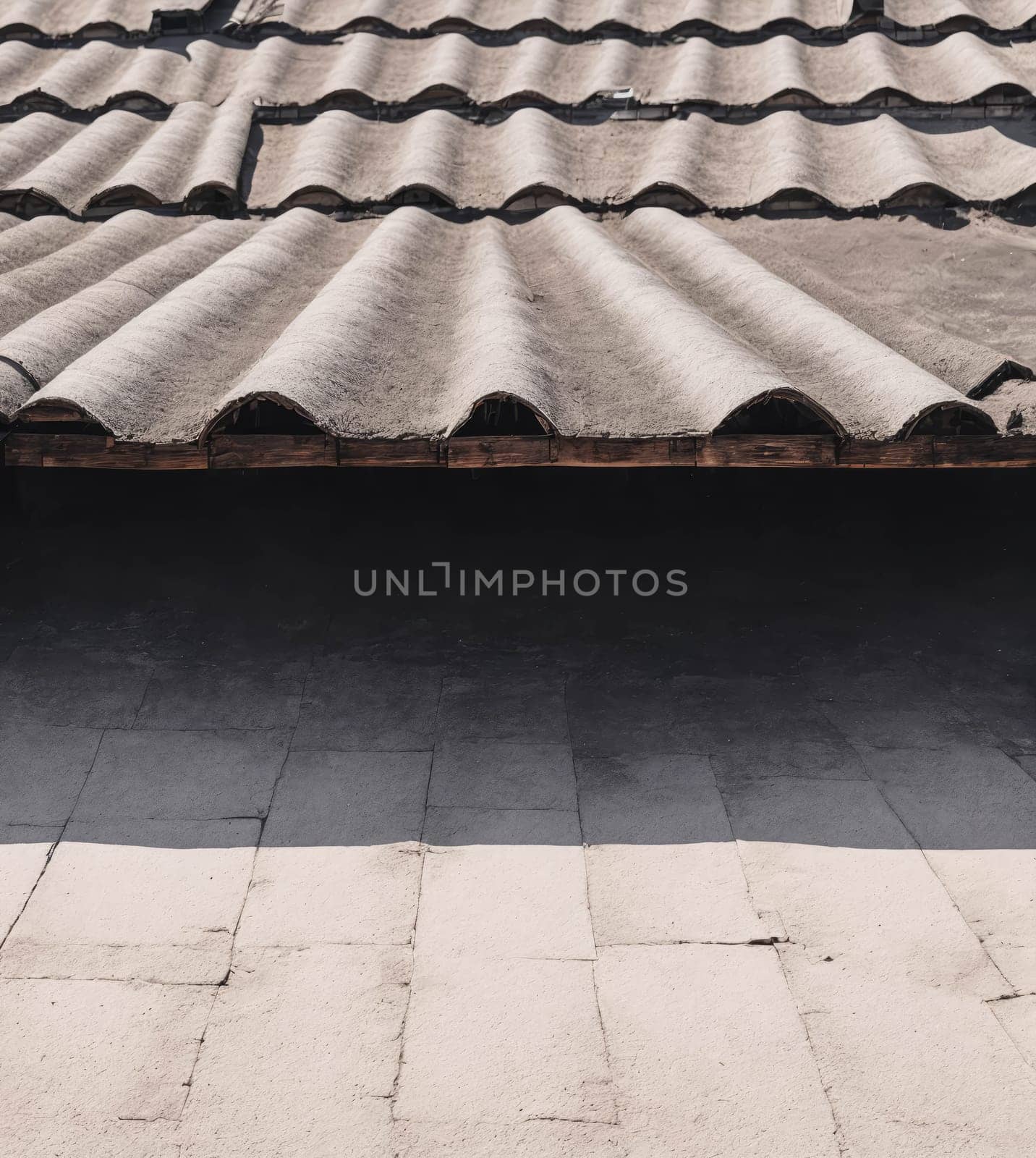 A roof with a tile pattern and a shadow on the ground