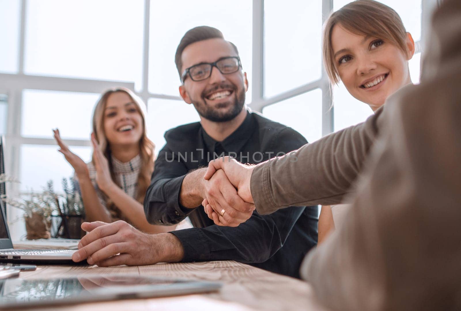 handshake business people at a meeting in the office. the concept of partnership .