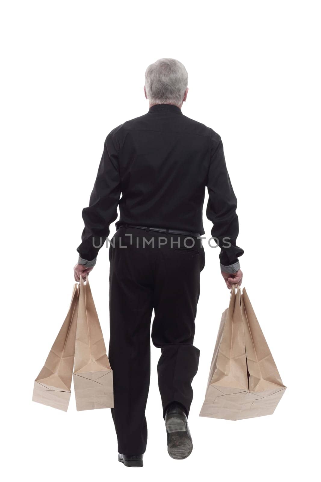casual man with shopping bags striding forward. by asdf