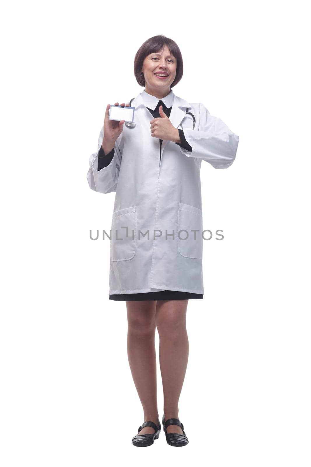 in full growth. young woman doctor showing her business card . isolated on a white background.