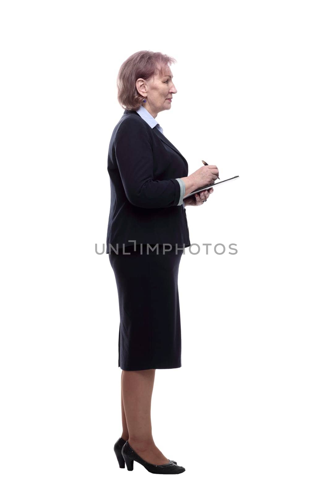 side view. business woman making notes in clipboard. isolated on a white