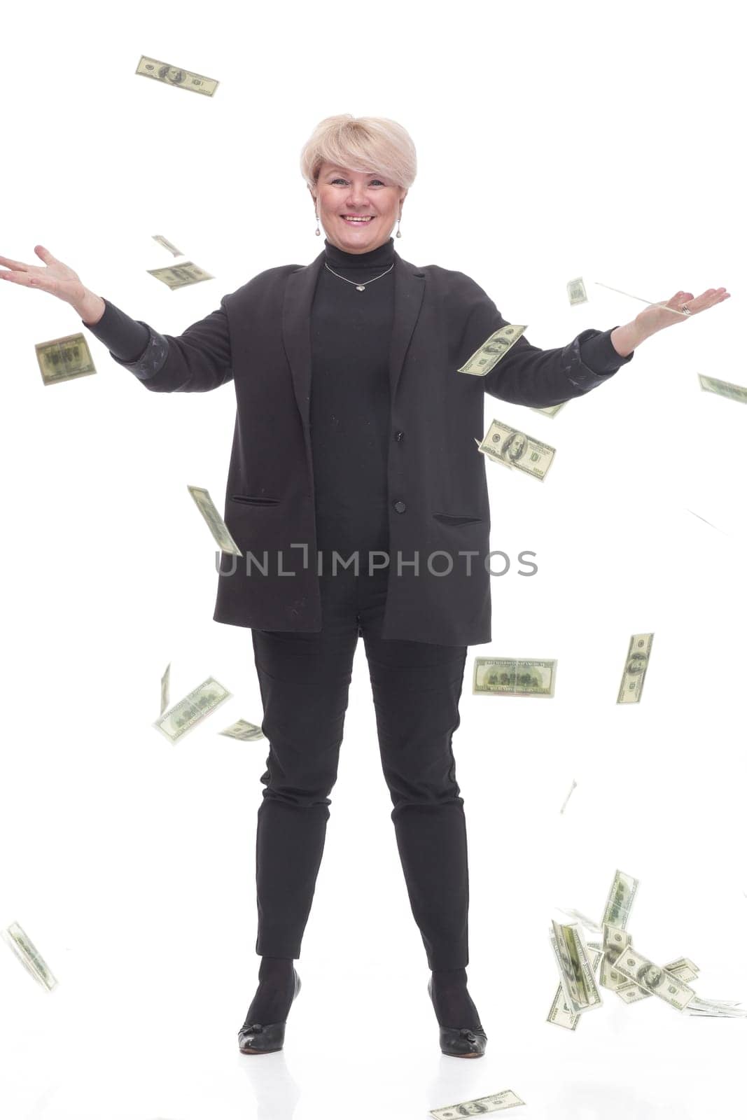 in full growth. happy business woman with banknotes. isolated on a white background.