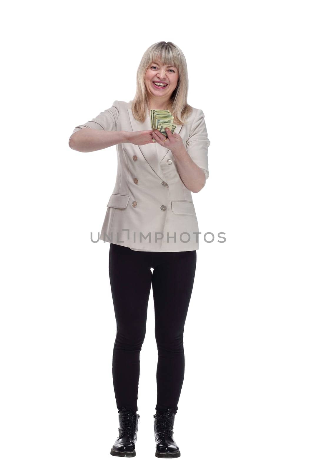 in full growth. very happy woman scattering a bundle of dollar bills. isolated on a white background.