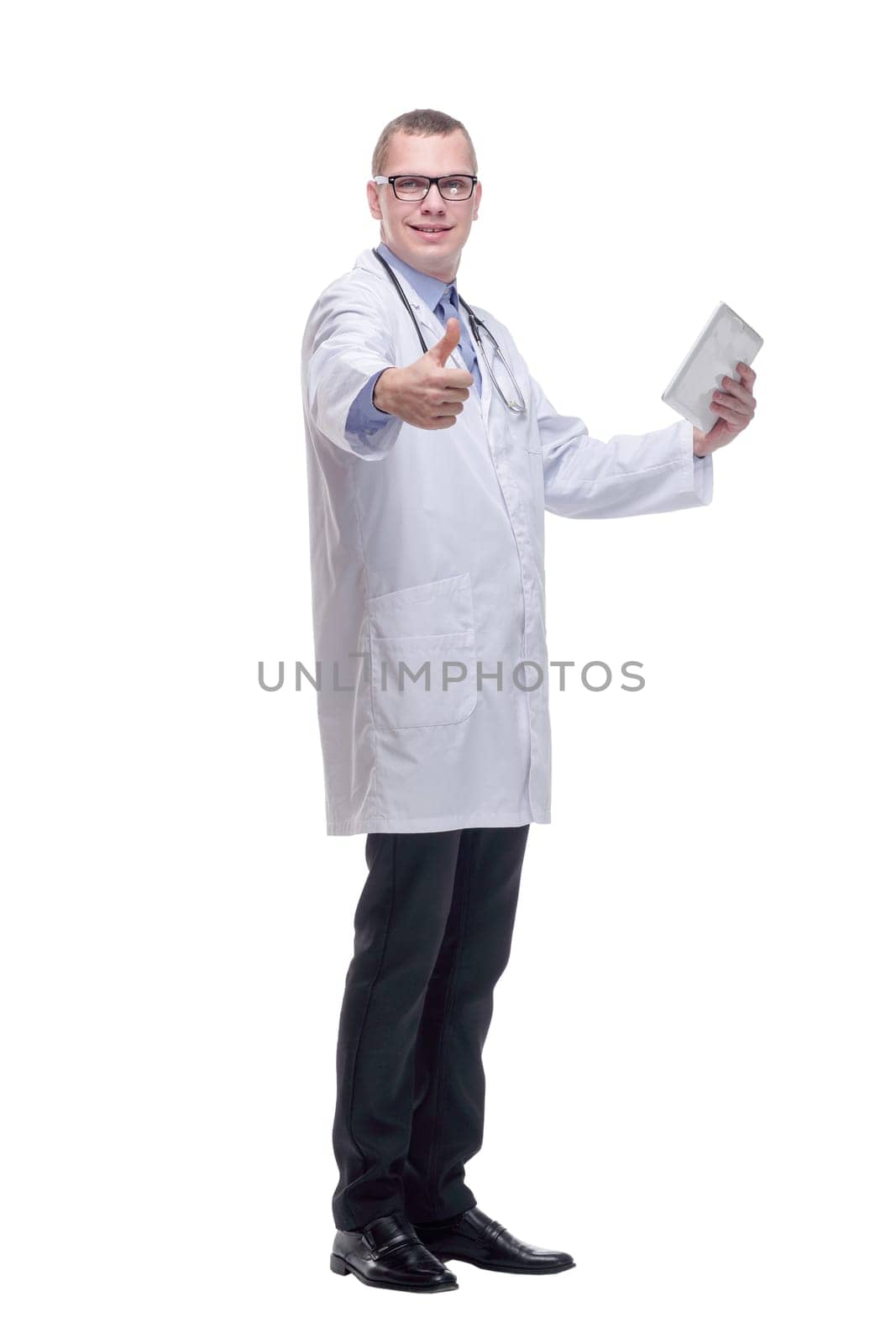 Full lenth side view of confident doctor using digital tablet. Isolated on white background