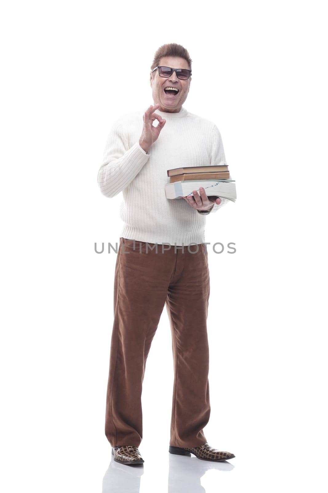 full- length . smiling adult man with a stack of documents . isolated on a white