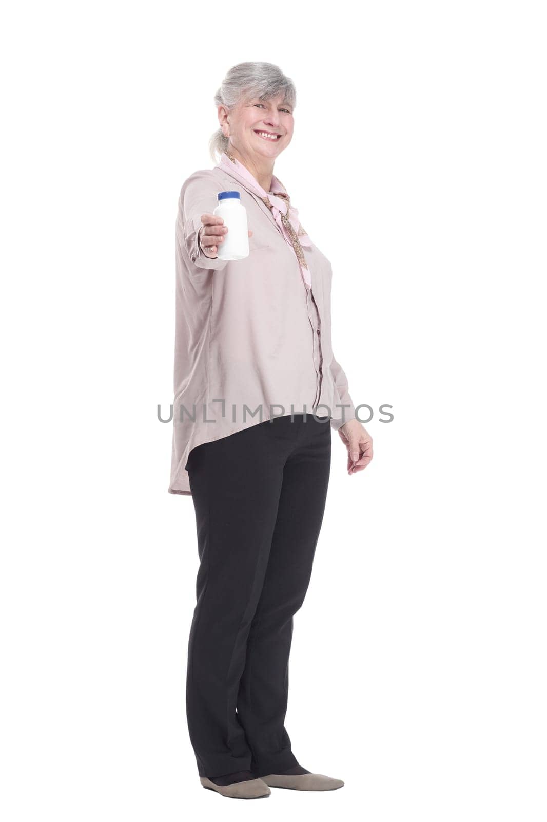 in full growth. smiling old woman with hand sanitizer. isolated on a white background.