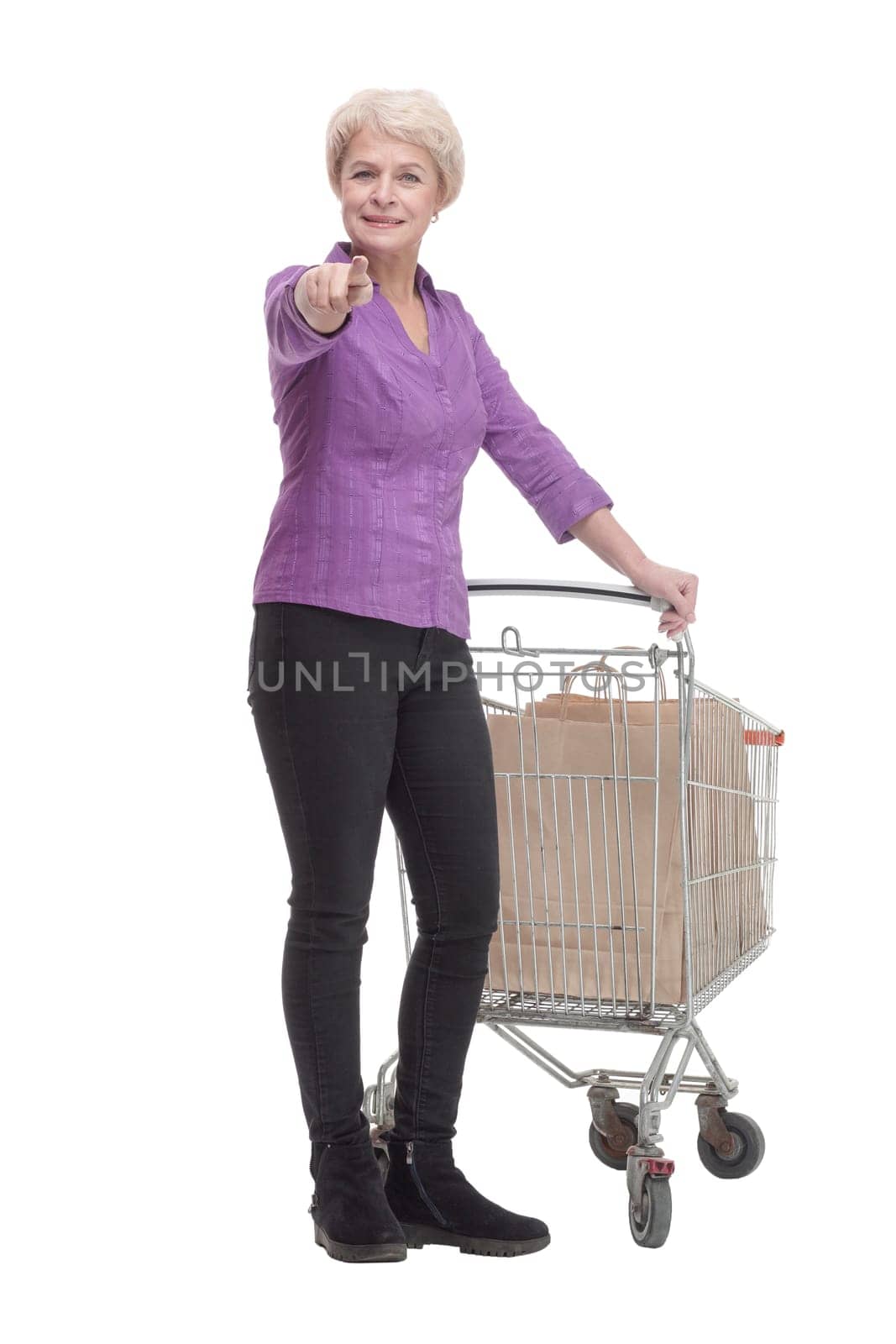 in full growth. casual mature woman with shopping cart. isolated on a white background.