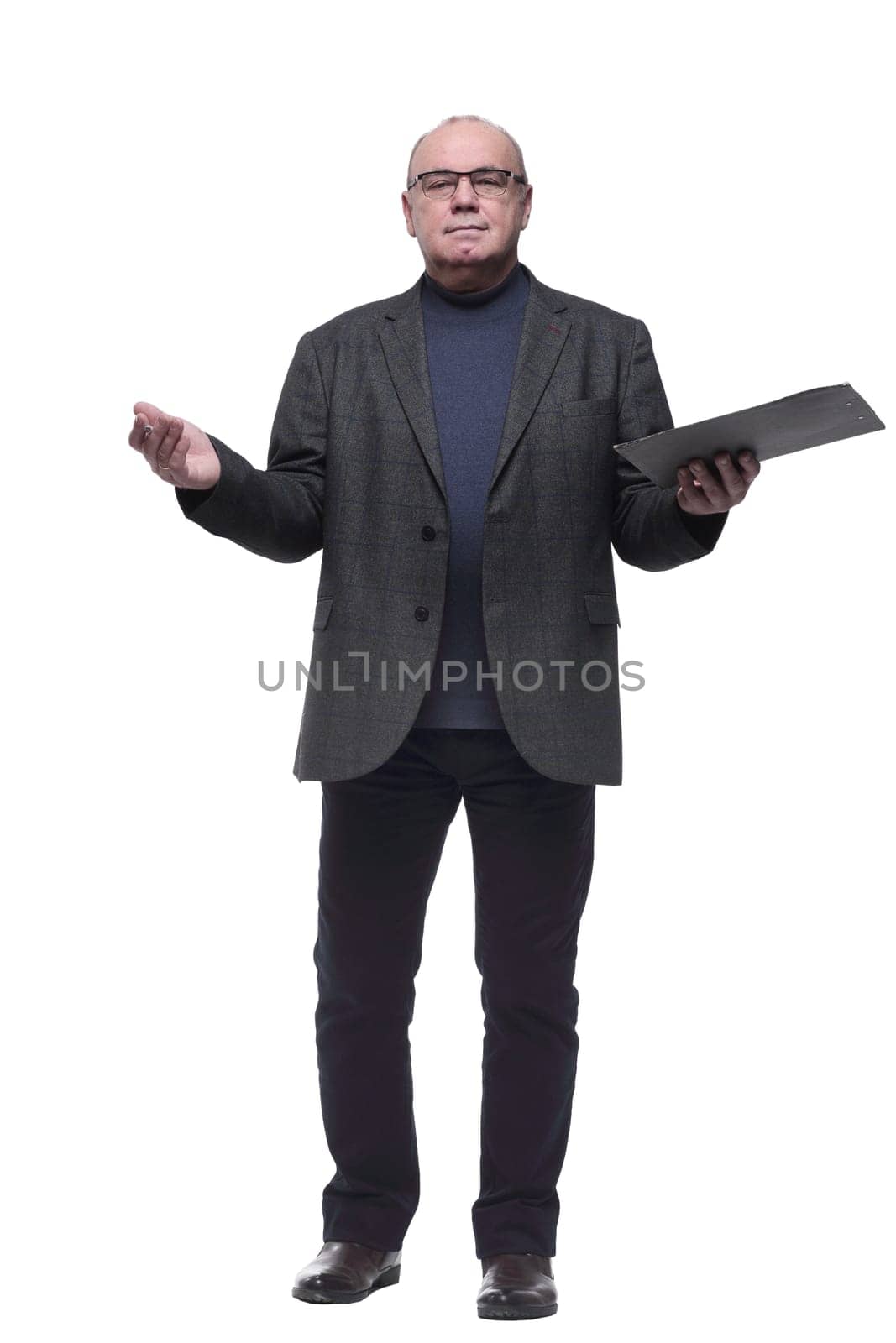 in full growth. business man making entries in the clipboard. isolated on a white background