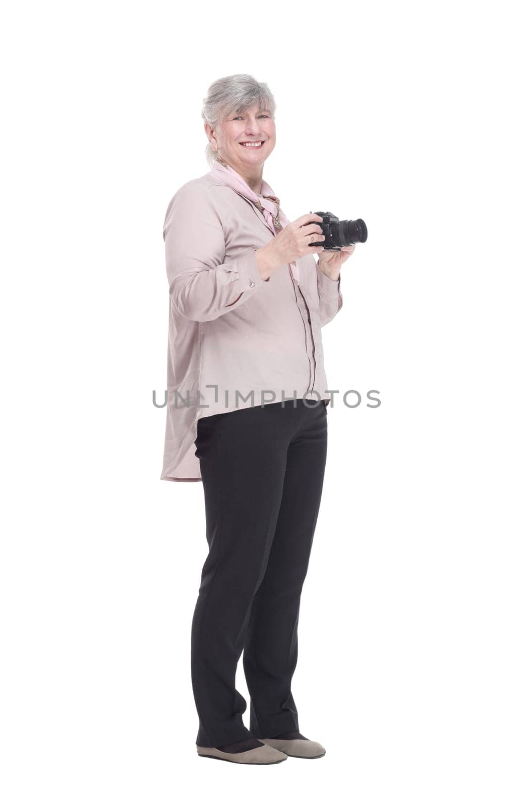 happy old lady with a camera in her hands. isolated on a white background. by asdf