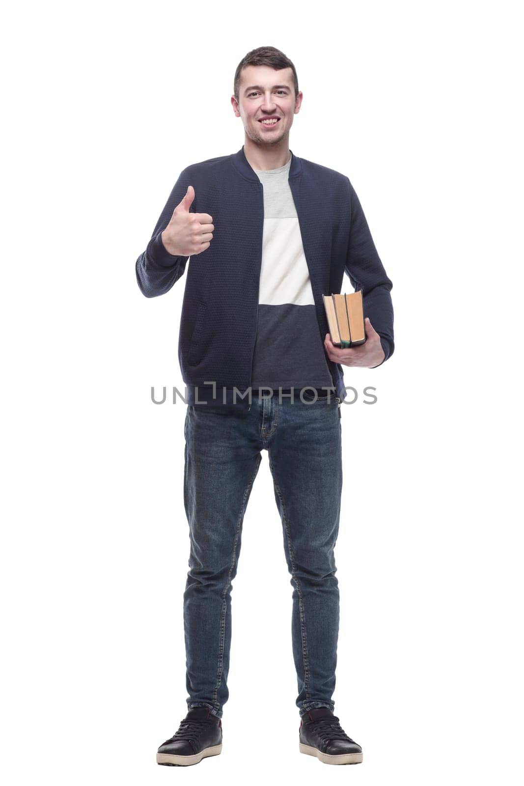 young man with a stack of books . isolated on a white background.