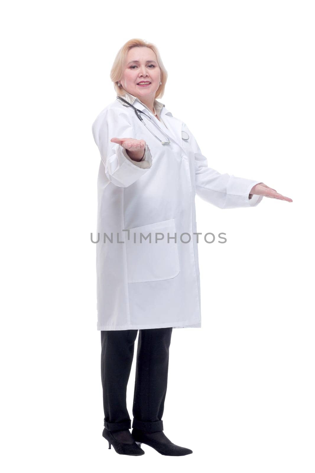 Beautiful attractive happy smiling female doctor physician nurse standing with arms crossed, isolated.