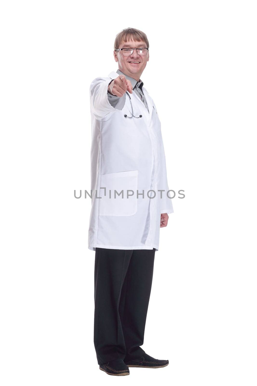 in full growth. successful male doctor with a stethoscope. isolated on a white background.