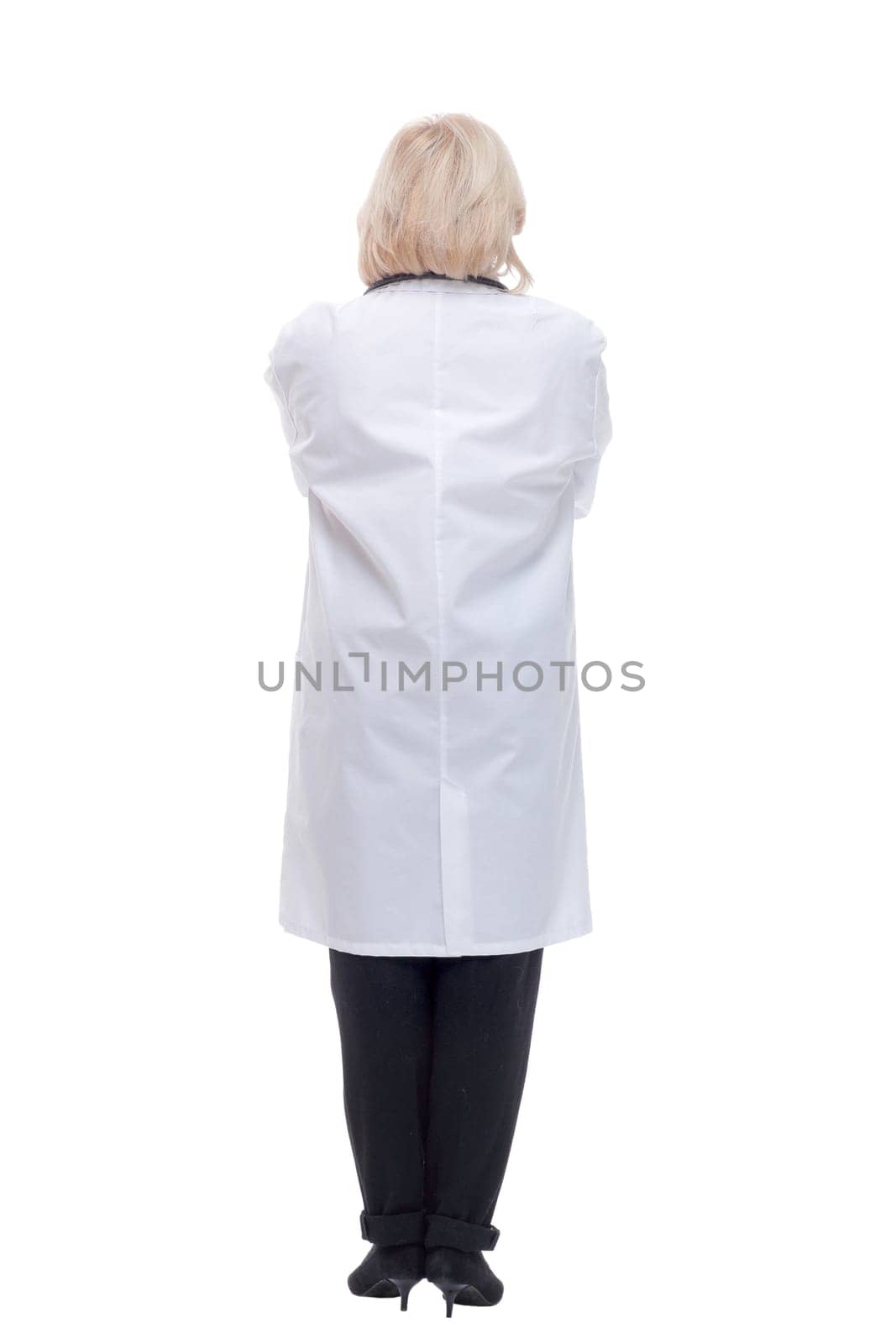 Full length back view of a health care worker standing isolated over white background