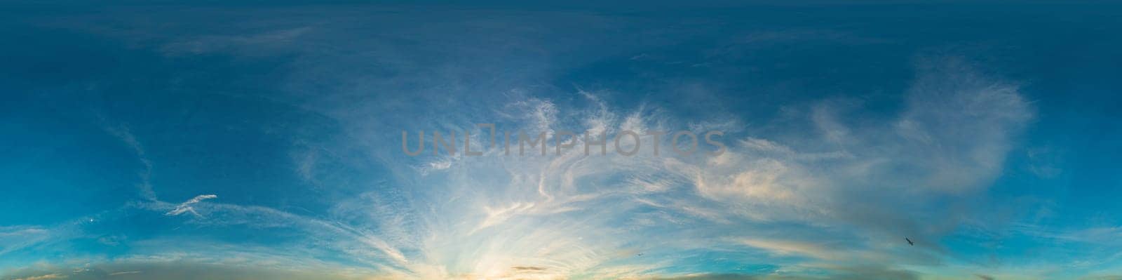 Bright sunset sky panorama with Cirrus clouds. Seamless hdr spherical equirectangular 360 panorama. Sky dome or zenith for 3D visualization, game and sky replacement for aerial drone 360 panoramas.