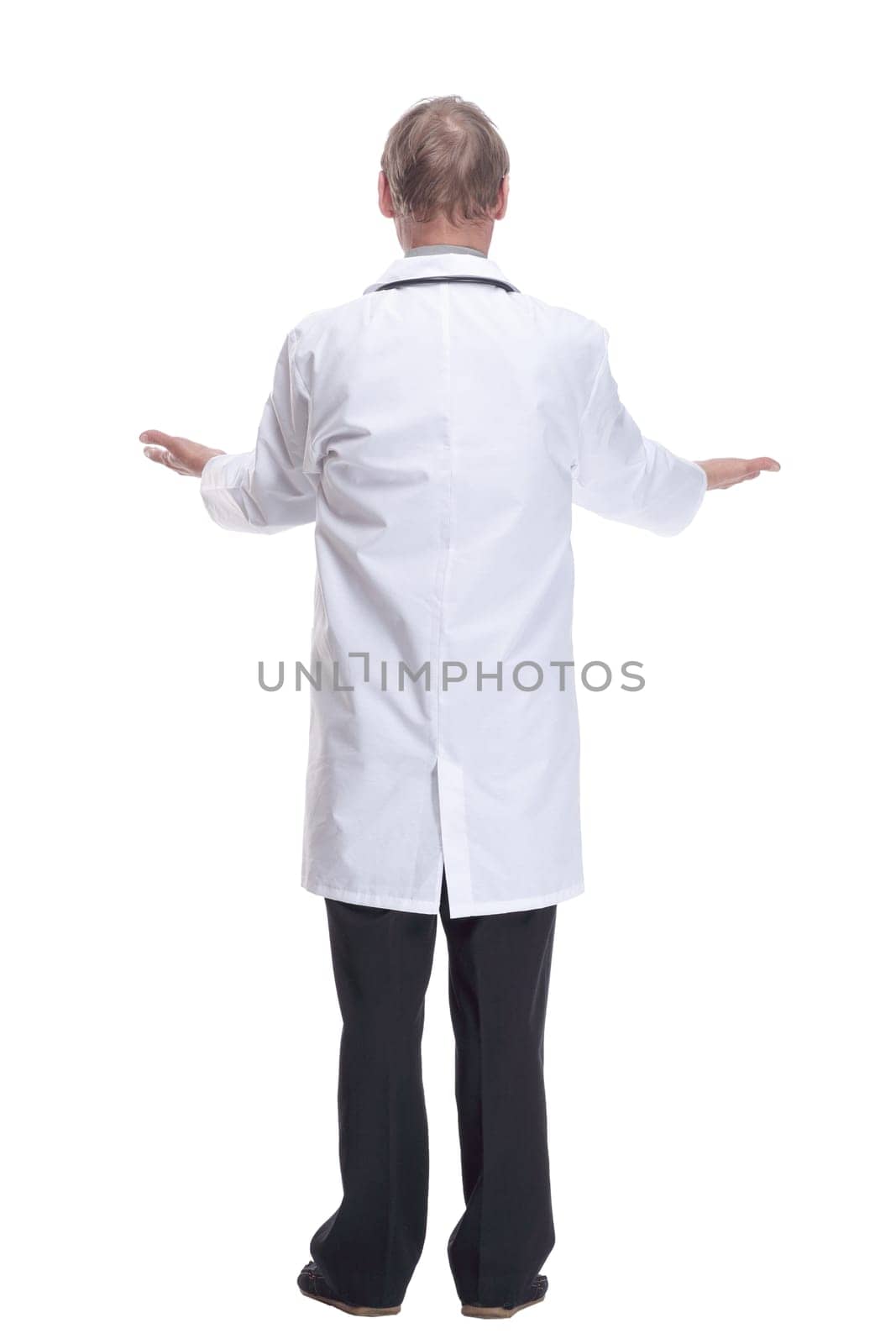 Mature doctor with a stethoscope reading an ad on a white screen. by asdf