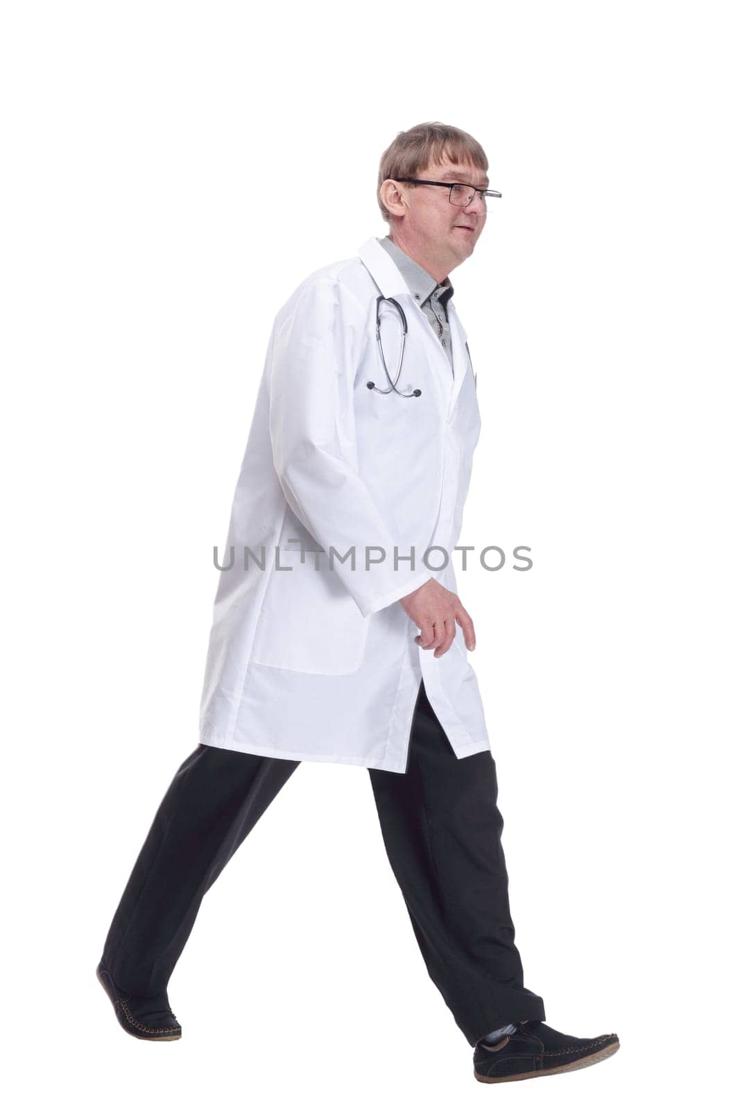 friendly doctor with a stethoscope striding forward . by asdf