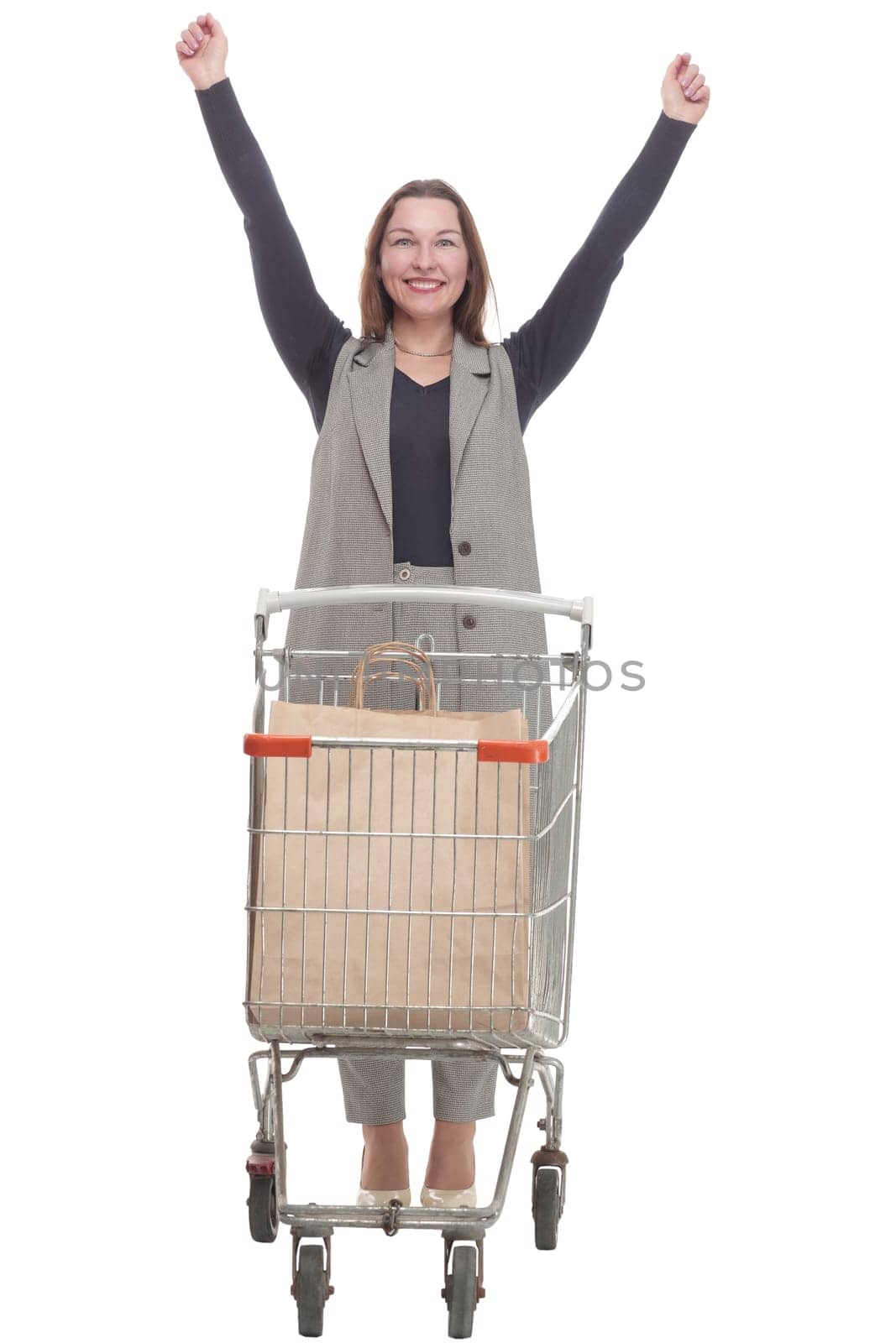 in full growth. elegant woman with a shopping cart.isolated on a white background.