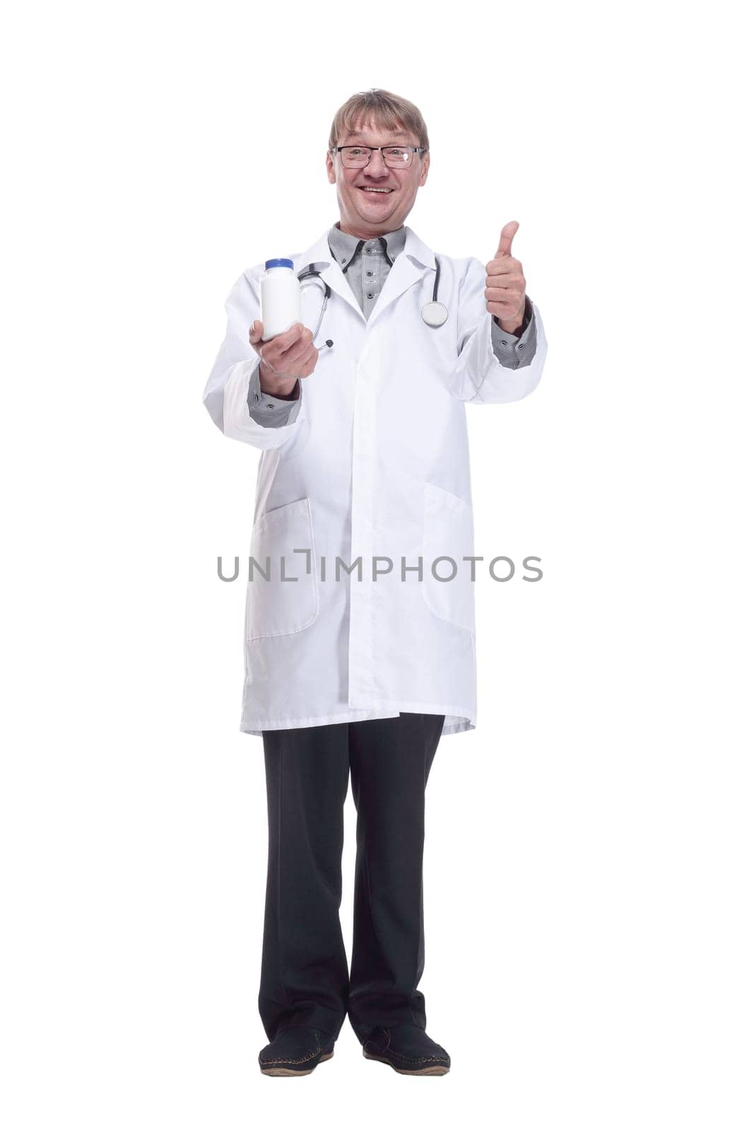 in full growth.smiling doctor showing a bottle of antiseptic. isolated on a white background.
