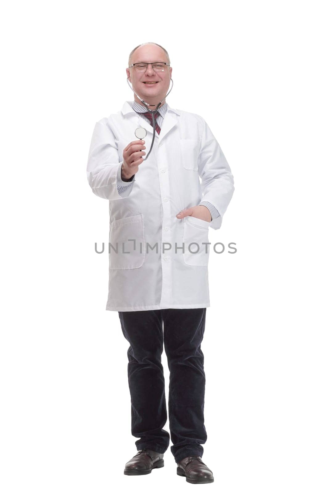 in full growth. qualified mature doctor in a white coat .isolated on a white background.