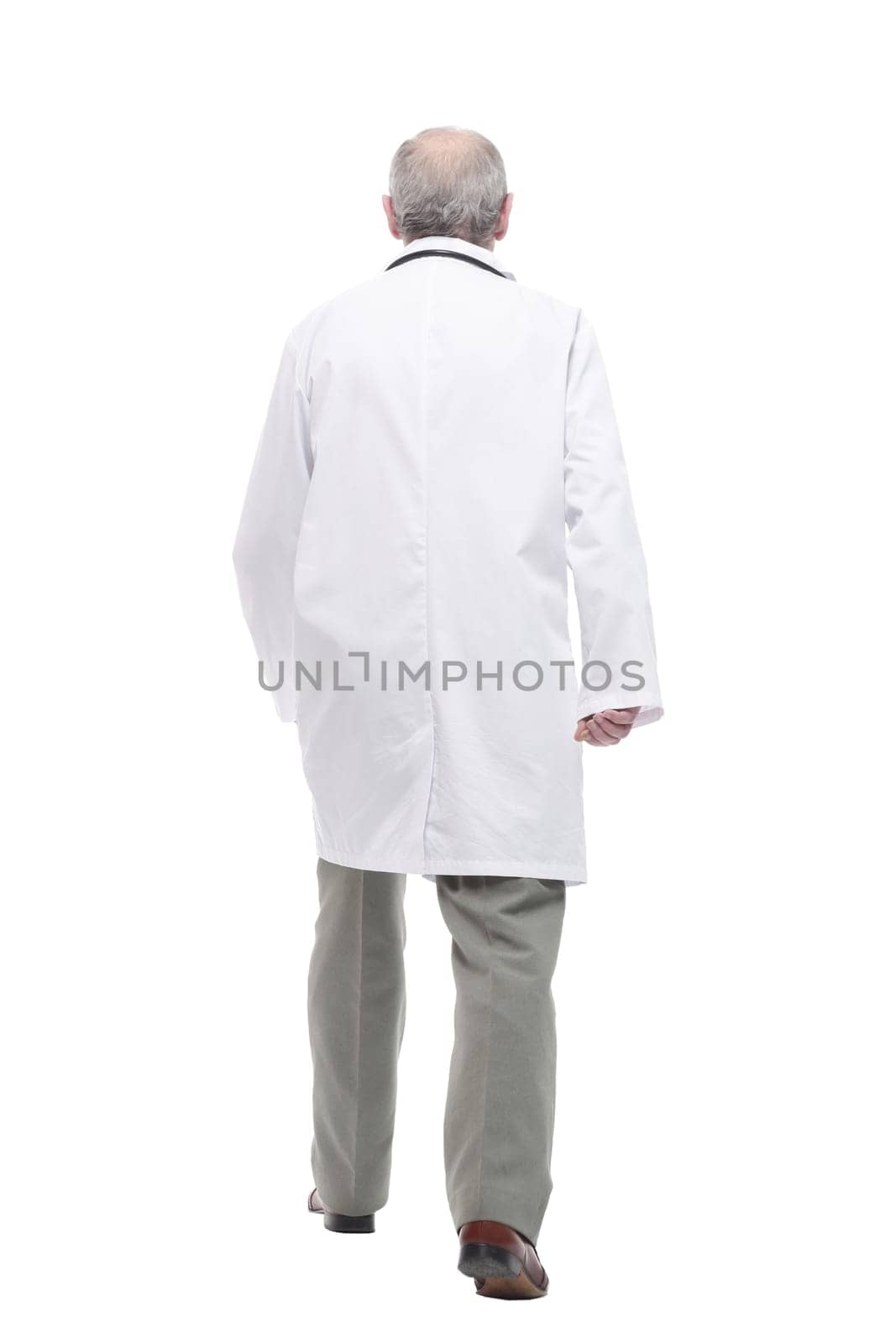 elderly competent doctor striding forward. isolated on a white by asdf