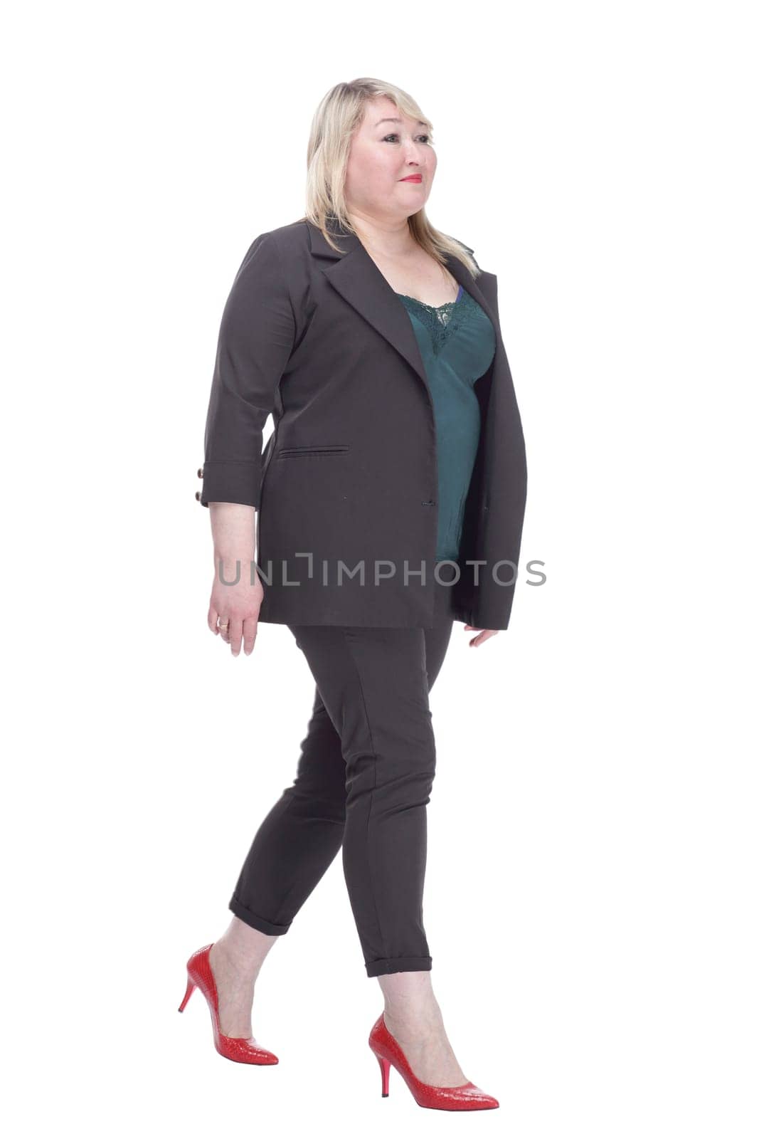 smiling woman in a summer pantsuit striding forward. by asdf