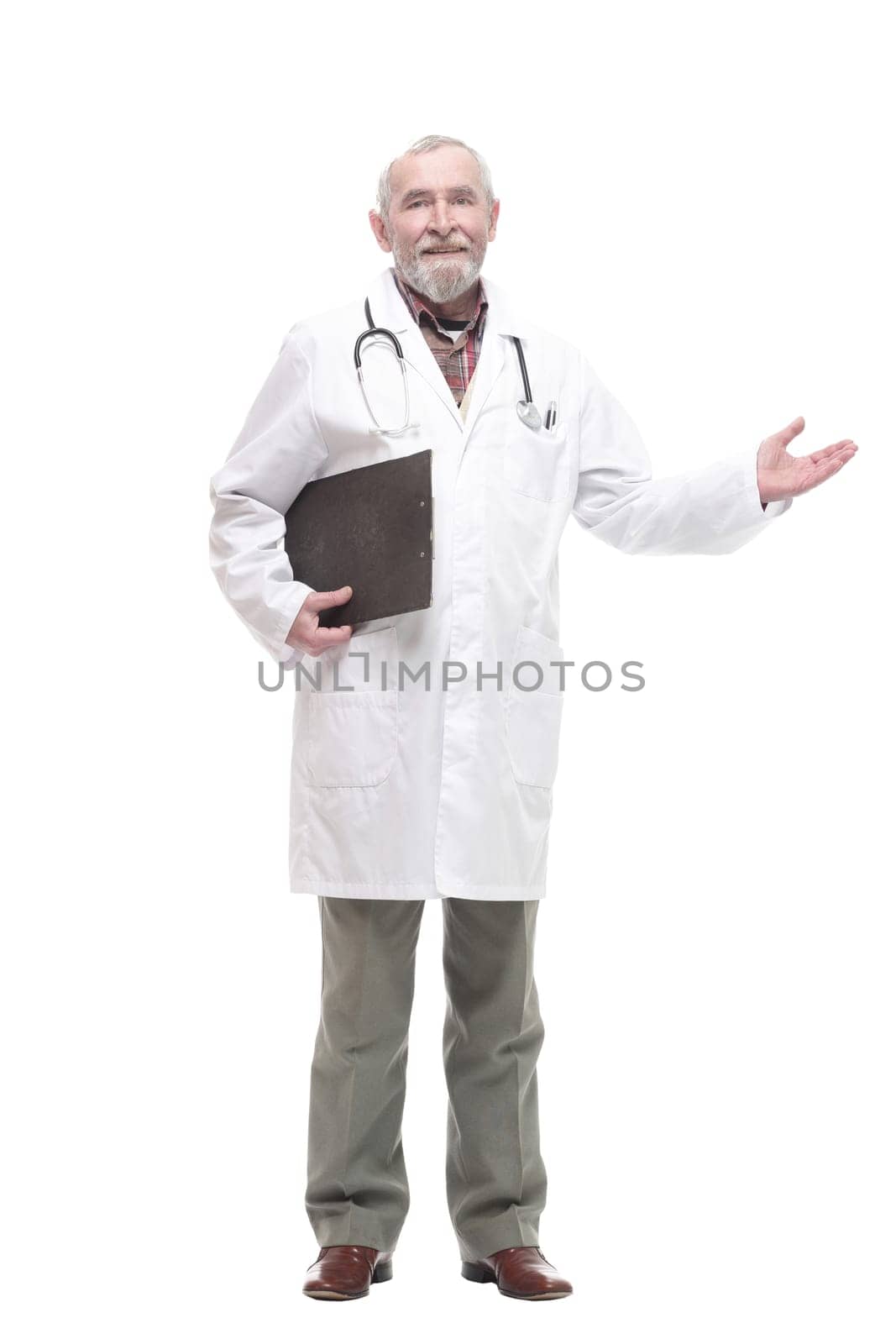 in full growth. elderly competent doctor with clipboard. isolated on a white background.
