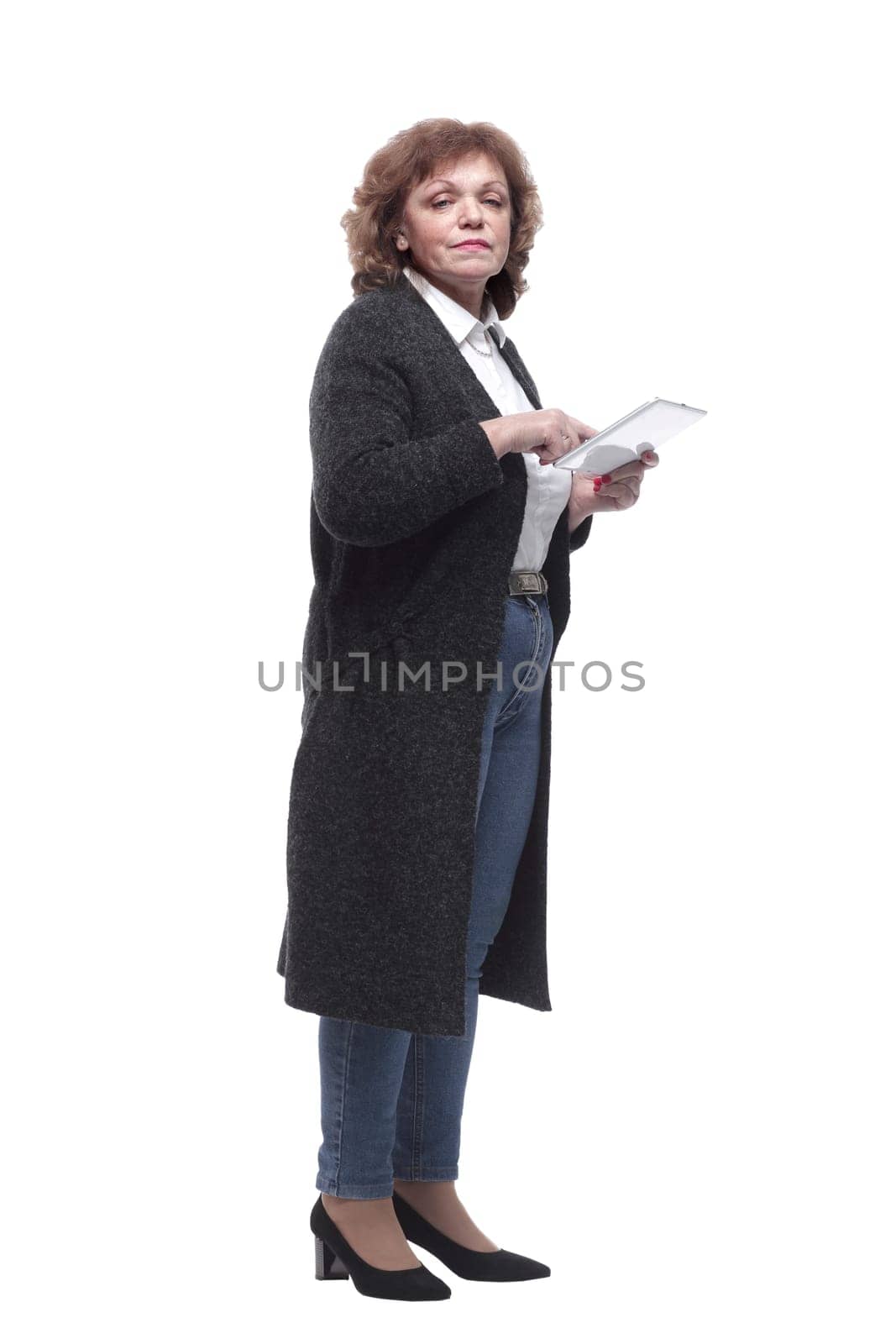 in full growth. mature woman with a digital tablet. isolated on a white background