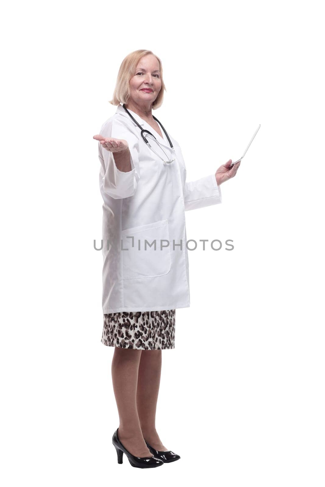 in full growth. medical woman with a digital tablet. isolated on a white background.